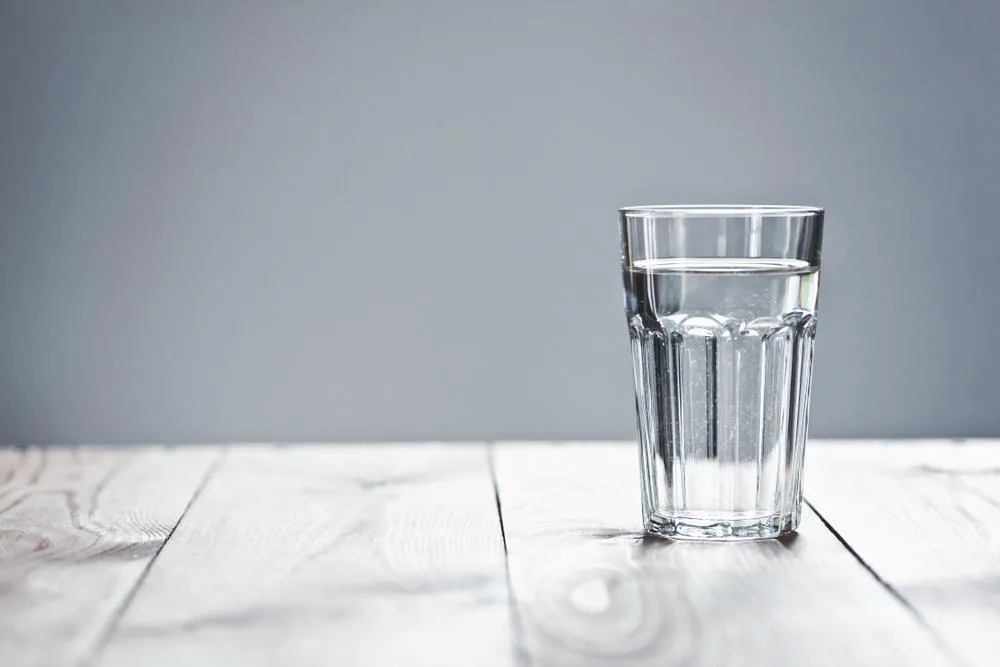 Drinking one or two glasses of water before meals can aid in reducing appetite